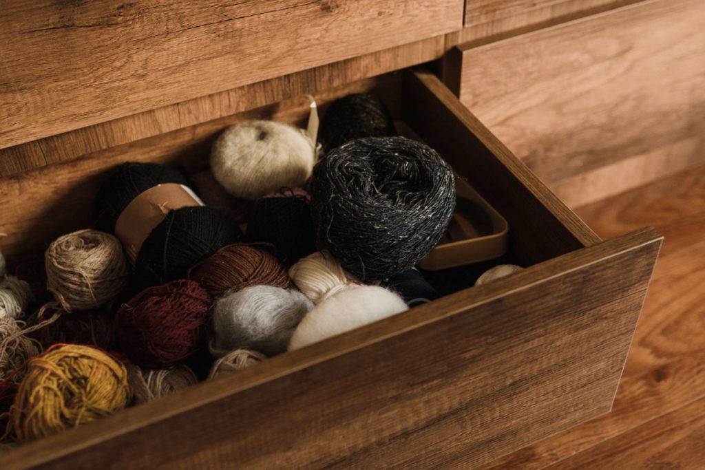 various yarns in a wooden box how to help donate baby blankets near me